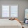 a bedroom with a bed and a tv