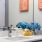 a bathroom with a sink and flowers